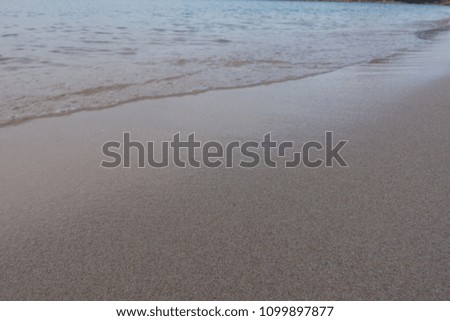 Beautiful background beach in summer. Royalty high-quality free stock image of sea water on the beach with sand and sunshine in summer