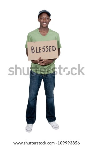 Handsome young man holding up a sign that says Blessed