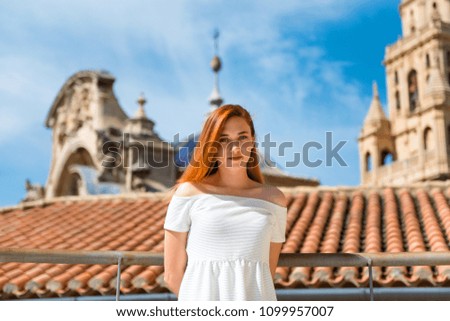 Portrair of young redhead pretty girl outdoor