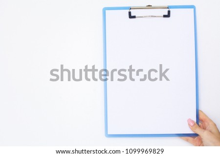 Blank Folder with White Paper. Hand that Holding Folder and Handle on White Background. Copyspace. Place for Text.