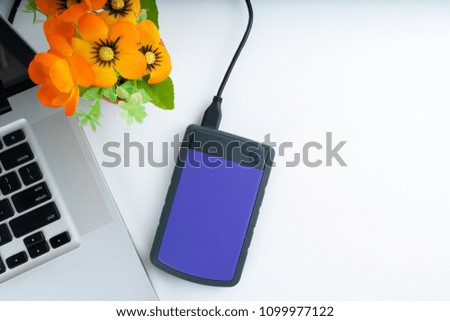 office decoration with laptop, money, compass and camera isolated white background, concept travel and insurance 