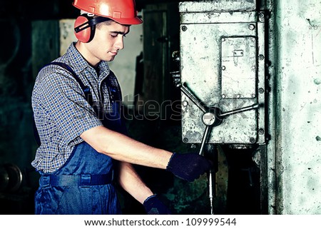 Industry: a worker at a manufacturing area.
