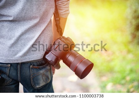 A photographer with his camera