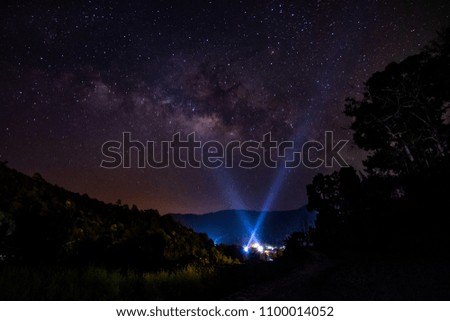 The Milky Way Galaxy, in the middle of the mountains and a flashlight on the sky 