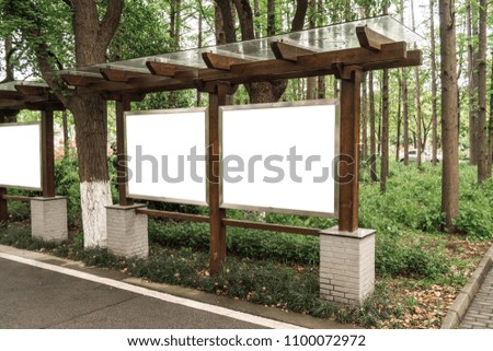 Billboards, trees and wooden signs in the park