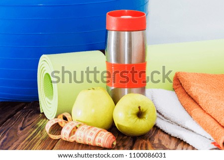 ball, yoga Mat and water bottle close up. Sports equipment,