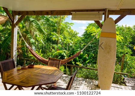 Surfer home at beach, house with surf boards at coast or shore, cabin or building with equipment for wave riding, bungalow at seashore. Exotic recreation and swimming, water theme