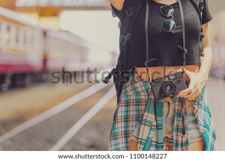 woman girl is holding retro styled camera train background city street travel, Travel lifestyle and seasonal vacation concept.