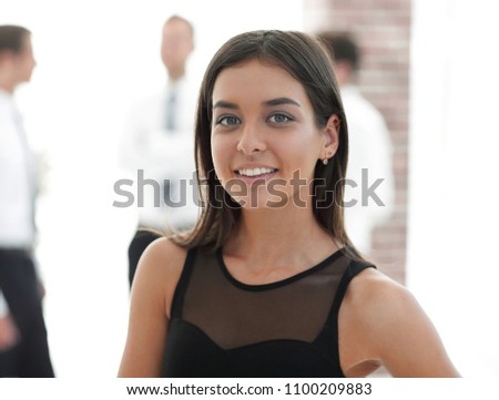 portrait of young business woman on blurred background.