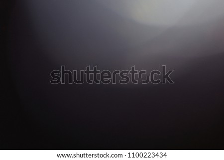 lens flare. glowing grey light. flash effect. abstract minimalistic background