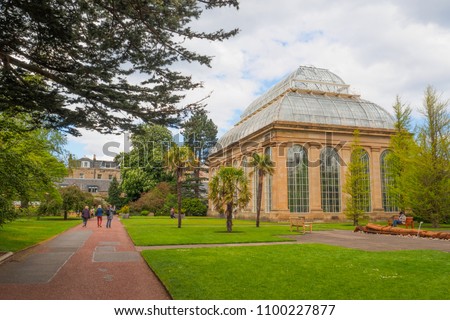 The Victorian Tropical Palm House, the oldest glasshouse at the Royal Botanic Gardens, a public park in Edinburgh, Scotland, UK. Royalty-Free Stock Photo #1100227877