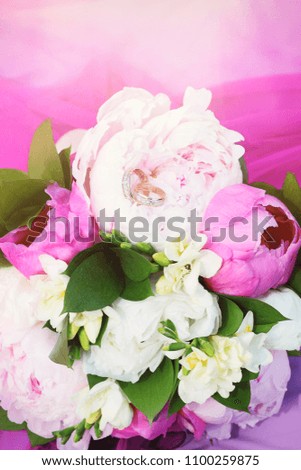 Prion pink bouquet and wedding rings