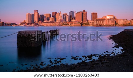 View of Boston at sunrise with abandoned pier