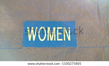 Blue "Woman" Sign
