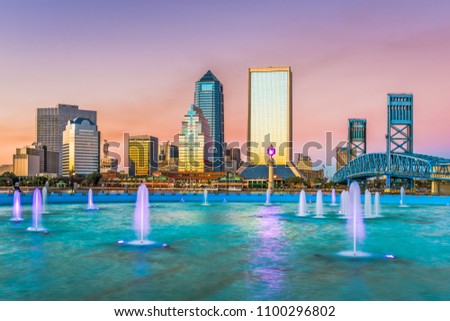 Jacksonville, Florida, USA downtown skyline and fountain at dusk.
