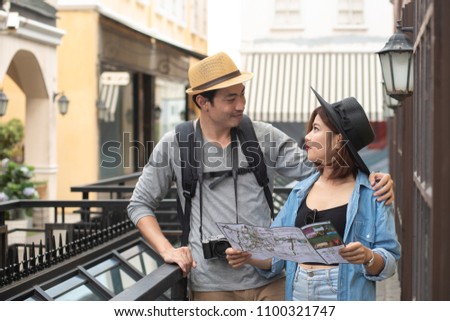 couple lover reading city map while traveling in the vintage city, travel concept