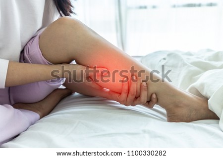 woman have a Calf leg pain and muscle leg pain,Healthcare concept Royalty-Free Stock Photo #1100330282