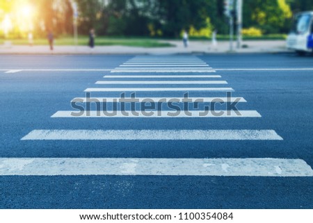 pedestrian crossing in the afternoon Royalty-Free Stock Photo #1100354084