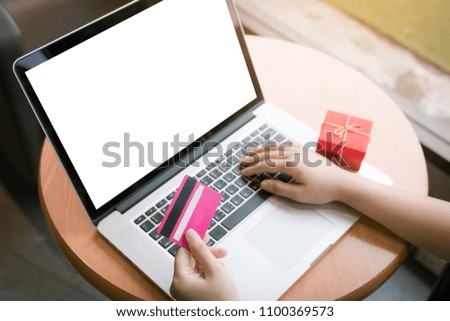 Shopping online concept with laptop blank screen.
