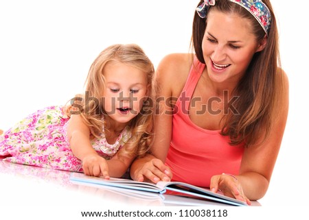 A portrait of a mother and daughter reading a book over white background