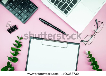 Women's stylish table. Workspace with blank white paper free space and pen in desk with flowers on pink pastel background for magazines, websites, media, Instagram. Flat lay, top view