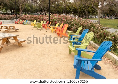 Colorful Adirondack chairs at Plaza de Cesar Chavez Park in Downtown San Jose, Silicon Valley, Northern California, USA.