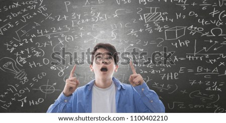 student amazed with graphics background and formulas