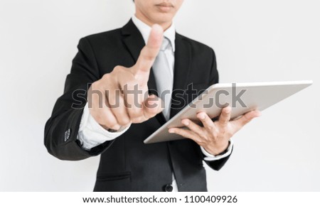 Modern businessman working on digital tablet, and touching on digital touch screen