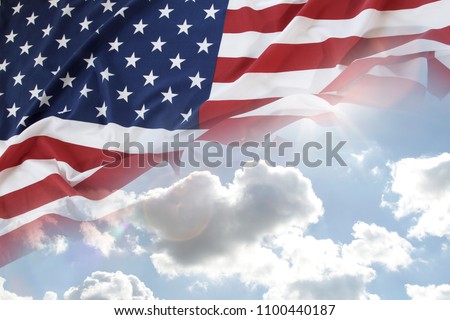 American flag in blue sky