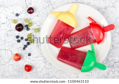 Various summer. Fresh berries in a wooden background. frozen juice. Antioxidants, detox diet, organic fruits