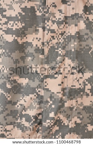 Military uniform with seams texture. Vertical cropped image.