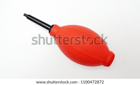  Red blower isolated on white background. Copy space                              