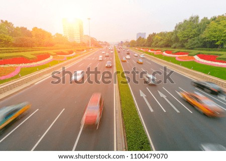 The traffic of the Beijing three ring lines is taken from the overpass. Slow door shooting effect, vehicle dynamic effect. Urban traffic background pictures.