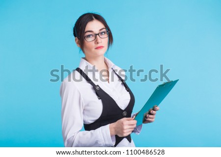 Business woman with folder on blue background