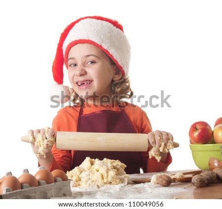 Merry Christmas - little girl baking Christmas cookies