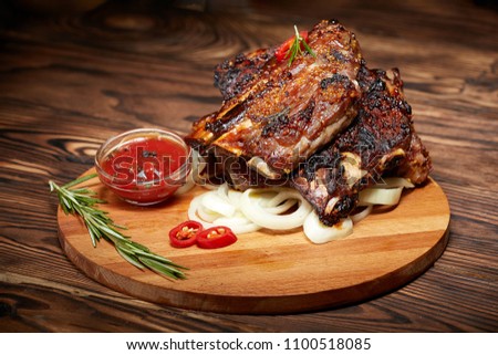 Background image of fried ribs with rosemary Royalty-Free Stock Photo #1100518085