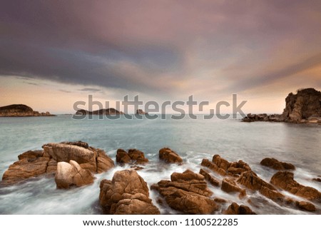 Sea landscape photo at beautiful bay with rocks on a front