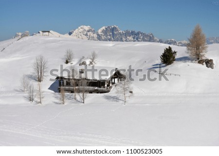 The hut buried in the snow