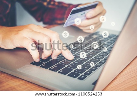 Online banking businessman using Laptop with credit card Fintech and Blockchain concept