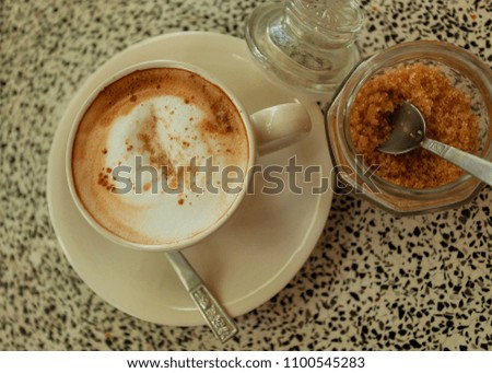 Hot capuccino with Brown sugar on the marble table