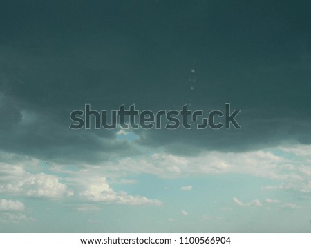 Clouds. Background landscape with clouds. Sunlight and rays. White and gray clouds before the rain. Thunderclouds.