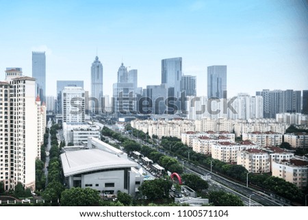 skyscrapers of a modern city with overlooking perspective under blue sky