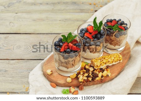Granola, yogurt and strawberries in a jars