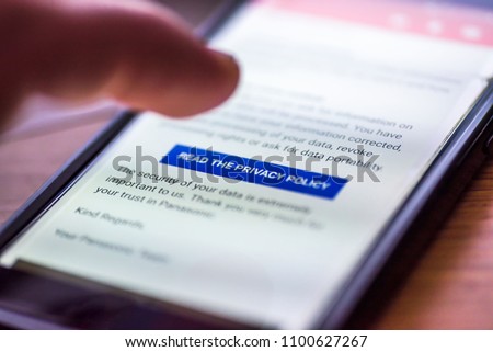 General Data Protection Regulation - GDPR - closeup human finger pointing to smartphone message button Read The Privacy Policy. Royalty-Free Stock Photo #1100627267