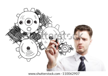 man drawing gears on a white background