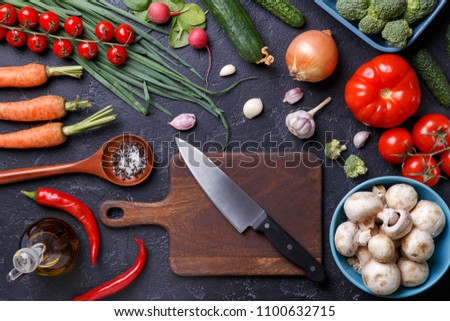 Photo on top of fresh vegetables, champignons, cutting board, oil, knife