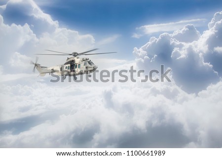 Helicopter Thai army is flying over the clouds.