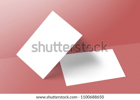 Blank business cards on red background. Mockup for branding identity. 
