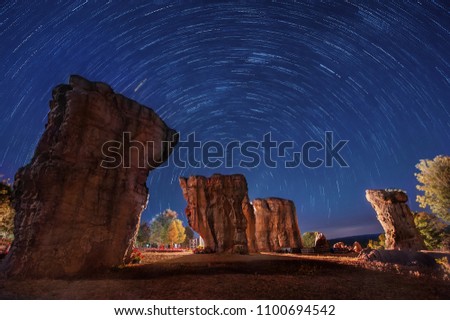 Star trails over the big white rock (Moh hin kao). Polar North Star at the center of rotation