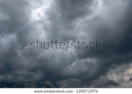 Dark cloudy sky over city